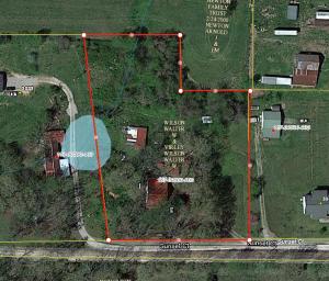 Three bedroom 1 1/2 bath in country setting but close to town. This home is in need of some TLC but has the potential to be a great home for a family. The propane tank is owned, and there is an out building in the back that could be used for extra storage or a workshop.