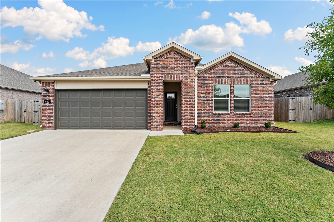 Built in 2023, this all-brick home blends modern efficiency with smart upgrades and a prime Rogers location. Solar panels will be paid off at closing, providing instant energy savings. The open layout features a kitchen with stainless steel appliances, flowing seamlessly into living spaces designed for everyday comfort. Upgrades include Deco smart switches compatible with Alexa, offering convenient, voice-controlled lighting throughout the home. Bedrooms are spacious with ample natural light, while the bathrooms showcase clean, modern finishes. Outside, enjoy a fully fenced backyard, ideal for pets, kids, or entertaining. Located directly along the 13th Street Bikeway, you’ll have access to the AR Art Academy, Railyard Loop, and Blossom Way Trailhead, connecting you to Rogers renowned art scene, cycling network, and outdoor lifestyle. Opportunities like this don’t come along often. A nearly new home with premium upgrades, solar panels, access to Rogers renowned biking and trail system makes this home for you.