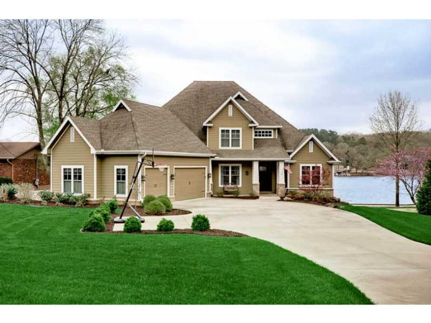 This house will leave you breathless. This is what lake front living is all about. From the Kitchen to the Master Suite you have stunning views of the lake. This home offers so much in terms of space w/ 2 bonus areas, unfinished basement/work shop, &,oversized 3 car garage. The outdoor patio with its sand finished floors and outdoor fireplace opens up to a large backyard with its own boat dock & lift.