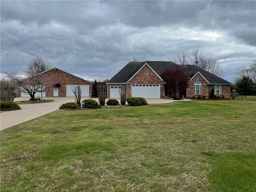 3361 N. Oak St, Springdale. Main home is 2799 sq. ft. Brick in Northeast Springdale on 8 acres. 3 BR, 2.5 Bath (Master bath has Whirlpool) Kitchen has custom-built cabinets, LED lighting, & corian countertops. Dining room has built in China cabinets. Living room has fireplace, Family room, Office/craft room, 3 car attached garage. HVAC has been replaced recently. There is also a 50x70 detached shop (bricked to match house) with 2 garage doors 9' & 16' wide. Covered Patio (20x50) with outdoor kitchen near inground Gunite pool. Beautiful Landscaping. Second home is 2 BR, 1 Bath (1490 sq. ft.) and is currently being used as rental. See MLS#1216252 for Main House, Shop & 1.5 acres.