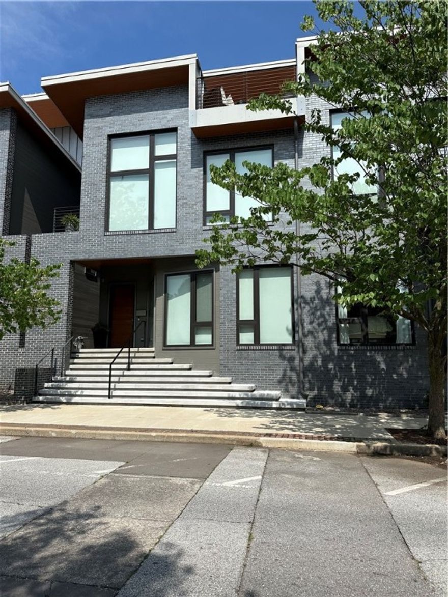 Sold Before Print. Modern, unique, upscale town homes with many high end amenities and vaulted ceilings, located in Downtown Fayetteville between Dickson Street and the Square. Custom iron staircase, dumbwaiter, tankless hot water heater, tons of storage, etc… Located right next door to Atlas restaurant, close to many music/food/entertainment venues, as well as the Razorback Greenway.