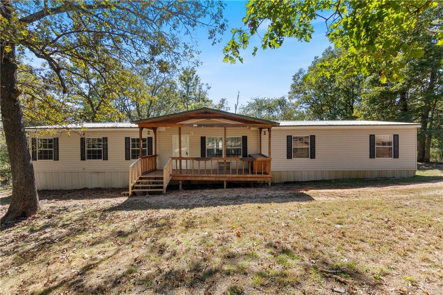 Welcome to 21577 Fern Rd — a peaceful country retreat just minutes from Elkins! This 3 bedroom, 2 bath mobile home sits on 2.5 acres, offering space to breathe and enjoy the outdoors. Relax on the covered front porch or entertain on the back deck overlooking a fenced yard, perfect for pets or play. Inside, you’ll find two inviting living areas — one featuring a cozy wood-burning stove and the other a wood-burning fireplace, creating warmth and charm throughout. The spacious primary suite includes a large walk-in closet, garden tub, and a versatile bonus area ideal for an office, nursery, or reading nook. Whether you’re looking for a quiet homestead or a weekend getaway, this property offers comfort, privacy, and the freedom of country living with easy access to town conveniences.