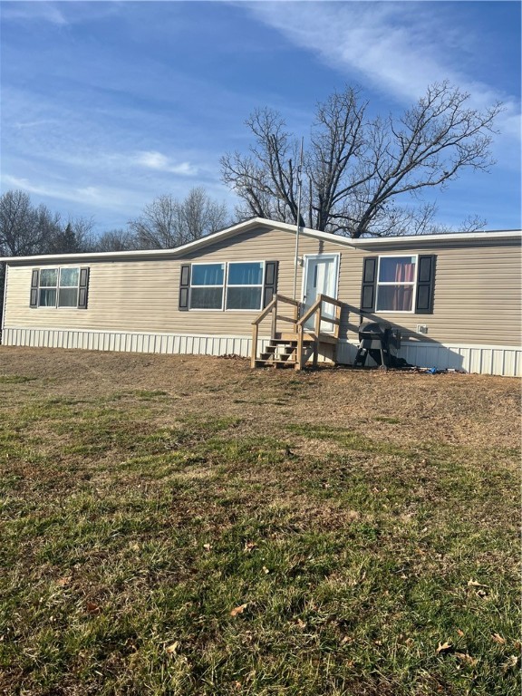 LISTED BELOW APPRASIED VALUE. Home and 5 acres! This is a 2019 model double wide by Clayton homes. Home was set up on property in 2019 on a permanent foundation along with a new septic system. Home is 3 bed 2 bath with green forest city water.