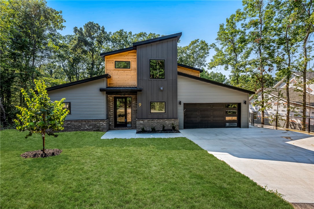 Step into this light-filled 3-bedroom, 2.5-bath home where modern design meets everyday comfort. Thoughtfully designed with tons of extra windows. Inside, youāll find custom cabinetry, modern hardware, and a sleek electric fireplace that serves as a stylish focal point. The kitchen, open-concept living areas, master bedroom, and laundry/butler's area feature luxury vinyl plank flooring. The upstairs bedrooms and flex space are carpeted for comfort. All bathrooms are finished with beautiful tile. Modern railing adds a contemporary architectural touch. Outside, youāll enjoy extra parking and a low-maintenance yard, giving you more time to relax and entertain.