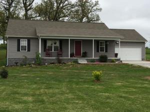 Nice home, large kitchen, cathedral ceiling, 34x6 covered front porch, 16x8 deck, large tree & fruit trees.