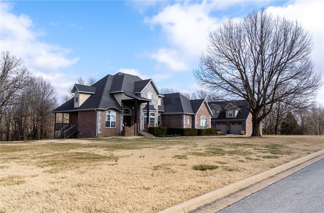 Beautiful 4,333 sqft 5 bedroom 3 full baths with 2 half baths on 2.66 Acres! Master suite with large walk in closet located on the main floor with 4 bedrooms and 2 full baths upstairs. This home also features a attached 3 car garage with large storm shelter plus an additional detached 3 car garage for a total of 6 car garage with nice cabinets and gas fireplace! Upstairs is an amazing MAN CAVE
with full bar including 1/2 bath, speakers in the ceiling, dishwasher, small fridge and ice maker! This home also has an additional 1.33 acre lot that will be available to purchase. Talk to list agent for more information. This home is fantastic with plenty of room for all your family and friends and great for entertaining!