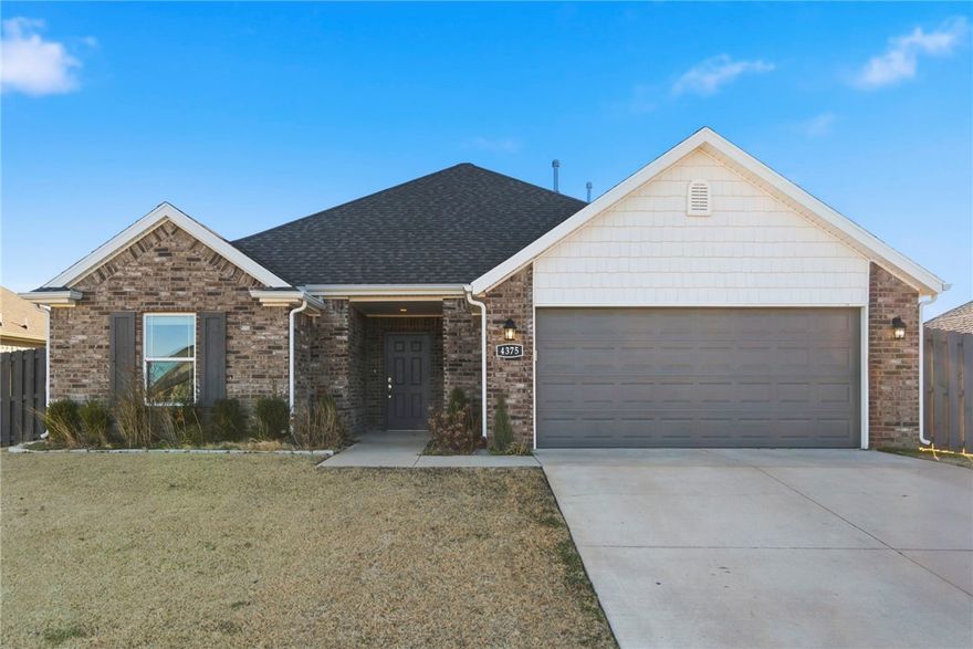 Immaculate all-brick 3 bed, 2 bath home in West Fayetteville. This split floor plan offers an open concept layout with beautiful flooring throughout the spacious living area, complete with a cozy gas fireplace and crown molding in the living room and primary suite. The kitchen features granite countertops, stainless steel appliances (including electric stove, microwave, and dishwasher), ample cabinetry, pantry space, and a generous eat-in dining area. The primary suite is a true retreat with dual sinks, matching granite, a whirlpool tub, separate tiled shower, and a large walk-in closet. All bedrooms are carpeted for comfort, and tile is featured in wet areas. Additional highlights include a utility room, pull-down attic storage, and energy-efficient features. Enjoy outdoor living with an extended covered patio and a fully fenced, private backyard in a prime location!