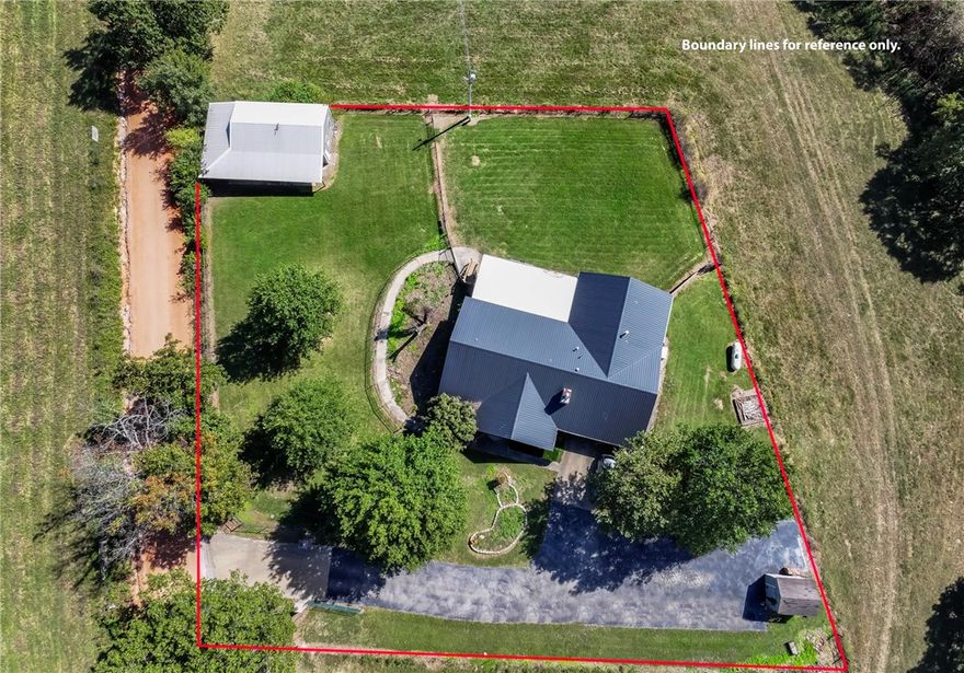 Highly motivated seller! Preferred lender credit up to $5000.00!! Razorback fans come live on Osage Hog Farm Rd! Perfect for Razorback fans, Hobby Farmers, or Gardeners! Charming 4278 sq ft home with 4 bedrooms & 3 full baths including a finished basement to host all those Razorback parties! A fully fenced 1 acre lot features a private gated entrance. Outside you will find a 20X40 shop perfect for storing your ATVs or your farm and gardening equipment. A shed offers additional storage for lawn equipment. The home boasts a beautiful kitchen with views of rolling pastures and a nearby river. The  energy efficient appliances in the kitchen were all replaced in 2023/2024. The basement includes two flex rooms a large game room and an in-law suite. This home could be used as rental income, you live upstairs and rent out the basement with it's own private entrance. The metal roof was added in 2020. This home is 10 miles from I-49 and 6 minutes from Hwy 412, also in the Springdale School District. New well in 2015.