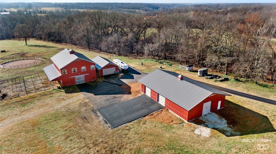 Experience the life with this truly amazing opportunity. Just minutes from town and encompassing over 36 acres of rolling landscape this unique property will not disappoint. Featuring an impressive barn with residence, 20x36 2 car garage, additional new insulated 40x60 building w/concrete flooring & three 10 ft doors, fully fenced, 2 ponds, 22x28 pole barn, new metal shelters for horses, RV parking a newly paved private drive. Ideal for the horse enthusiast with barn offering 4 stalls each with run, paddocks, shower and tack room with direct access to office and bath leading to an impressive residence above. Open concept with fabulous living & kitchen w/island, SS appliances, abundant cabinetry, vinyl wood flooring and two oversized bedrooms each with full bath. Step out on the deck and enjoy the panoramic views of pasture and woods offering lots of privacy. Gorgeous building site. Also listed under MLS#1208602 & and MLS#1208603.