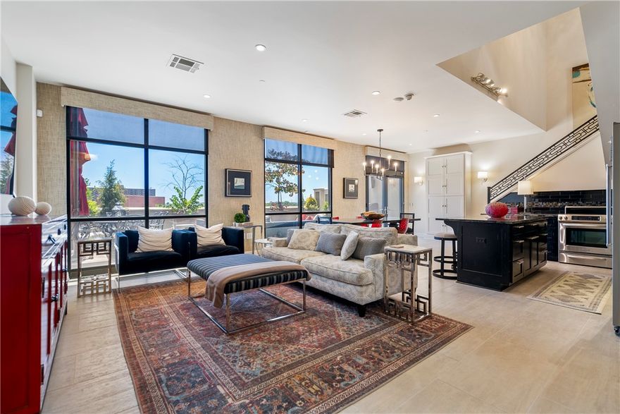 Luxury living in the Legacy Building in downtown Fayetteville. 2-level penthouse on the 5th & 6th floor. Entries on both floors. This is a rare opportunity to invest right off Dickson Street across from Walton Art Center and walkable to U of A, and Fayetteville Square. Southern views from floor-to-ceiling windows, approximately 600 sq. ft. patio, 2-bedroom 2.5 bath. Smart condo, digital lighting inside and out, Apple Home kit, Netgear Video, Nest Thermostat, door sensors, high-end furnishings convey (Al Gover Design), 1 parking spot in secured garage, on the east side. Legacy offers a private gym, & a party room. Condo has unparalleled security. Great for tailgates, investment property, and corporate condos. Greenway and walking trails are close by.