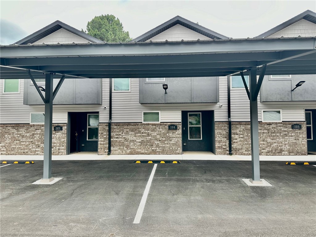 New Construction townhome in a perfect Fayetteville location. Close to the U of A, shopping, trails, I-49 and all NWA has to offer! 2 beds, 2.5 baths, 2 car covered parking. Large main floor for living area, laundry, 1/2 bath and kitchen. Bedrooms are located upstairs with private baths. LVP flooring in main areas, carpet on stairs and in bedrooms; ceiling fans in bedrooms and living room area. Kitchen has all stainless appliances. Refrigerator and full-size washer & dryer are included. Bluetooth speaker system in living area and on covered porch; Wi-Fi cameras for security. Located along UA bus route 35. Lawn care provided.