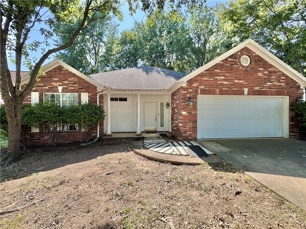 3 bedrooms, 2 full baths, extra spacious. Excellent location just minutes from offices, medical facilities, shopping, entertainment, and I-49. All brick home with split floor plan and TWO living areas, both with gas-log fireplaces. Faux-wood floor in living room, which is open to den/bonus room. Adjoining kitchen has lots of storage, built-in buffet and china shelves, plus under-cabinet lighting. Many windows, ceiling fans and blinds throughout the home. Master bathroom has 2 walk-in closets, 2-sink vanity and whirlpool tub plus double step-in shower. Extra-large utility room with many hanging rods. Covered front entry, large wood back deck, fenced back yard, double enclosed garage.