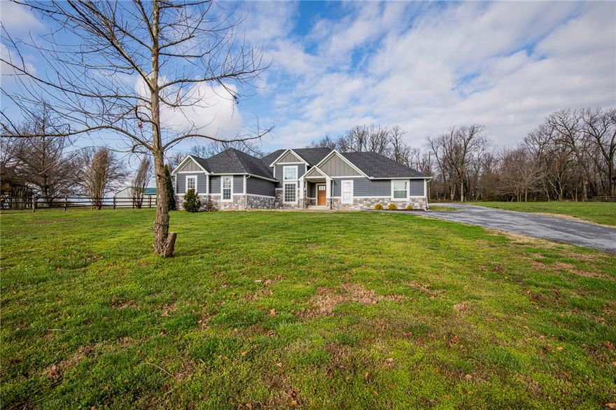 This is your rare opportunity to own a one level Craftsman style home on 2 acres with a 30x40 shop in city limits with no covenants and in Bentonville School district. Beautifully remodeled and immaculately maintained this home boasts 4 large bedrooms, two office spaces for those of you that work from home, two pantries with one being a walk in, an interior saferoom/shelter. Beautiful real wood floors in all living/bedroom areas and tile in all the wet areas. Shop was built in 2014 and is insulated and has a concrete floor with a 10' door and is tucked neatly behind the home. This home is truly "turn key" ready and waiting for you. Come see why you should buy this property.