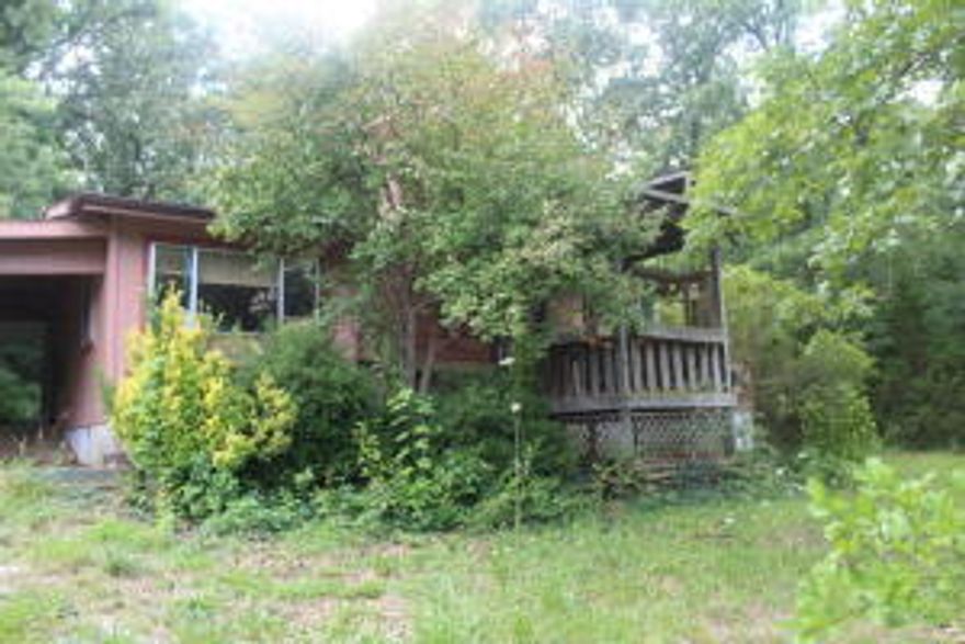 Seasonal lake view of Bull Shoals Lake! With some fixing up this would be a great weekend getaway! 2 bedroom, 1 bath with wood burning fireplace. Large living room, central heat and air. Priced to sell at $39,900!