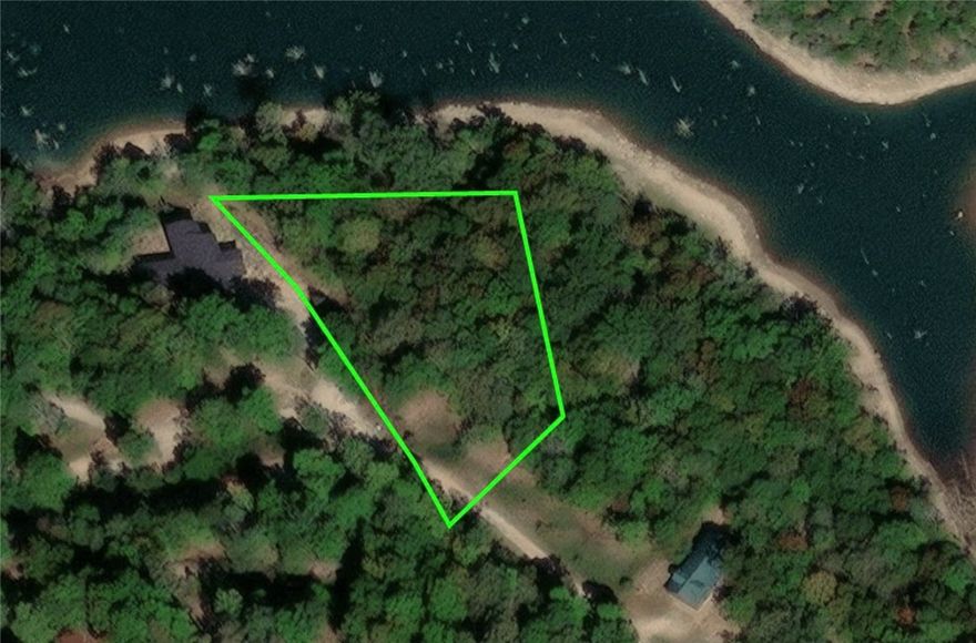 This is the GEM you have been looking for! Located outside the City limits of Eureka Springs, find your oasis and imagine the home you've been dreaming of building right here. This is Lake Front folks!  Recently graded road leads you down to the property, which has beautiful rock outcroppings up top and a gentle slope down to the water. Property is Bordered on the Army Corp of Engineers  Beaver Lake giving you Prime access to some of the most Beautiful waters in the Area! This Lot is being sold with a Dedicated Boat Slip with access to a Community Dock for your Boat! This .99 Acre lot is also being sold with an adjacent Lot which houses its own Septic and is already installed. Community well is ready for you, so no need to spend thousands on a well! Grab this one before its gone, this one is going to make a beautiful home site and checks all the boxes!
