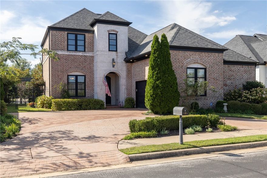 Located in the desirable Clear Creek Patio Homes, this residence offers timeless elegance minutes from I-49 & Willow Creek Women’s Hospital. Off the entry, French doors open to a formal living room ideal as a library or study, with a nearby half bath. A formal dining room with a double-sided fireplace connects to the main living area & flows into the kitchen with stainless appliances, granite countertops, a large island with seating, & an eat-in dining space. Fresh paint enhances much of the main level, including the formal living room, primary suite, kitchen, & office. A private office provides workspace, while the primary suite offers a spacious retreat with tray ceiling, dual vanities, jetted tub, walk-in shower, & a generous walk-in closet. Upstairs, three bedrooms & two full baths provide space for family or guests. Professionally landscaped grounds surround the fully fenced backyard with meandering pathways, a tranquil pond, covered patio, & pergola—an inviting setting for everyday living & entertaining.