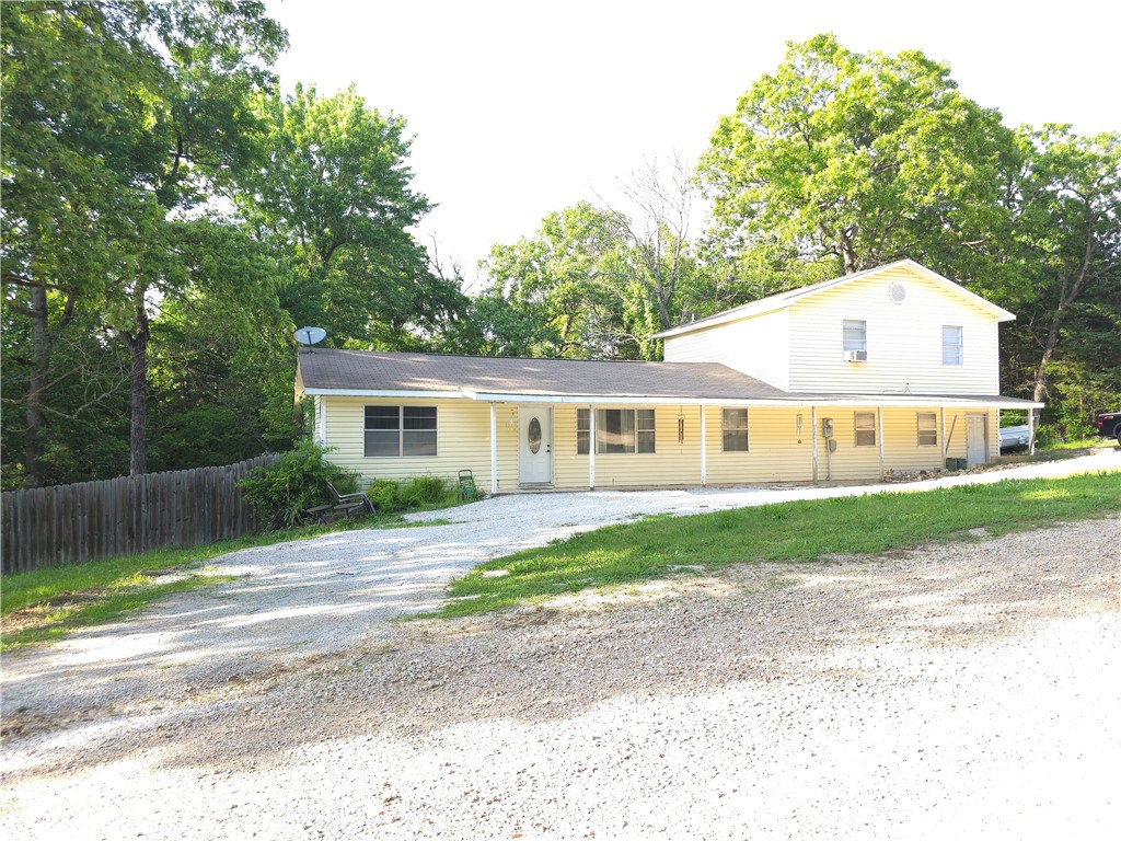 Large family size home is priced right and ready for it's new owners. This home has 1728 sq ft with 4 bedrooms, 2 bathrooms, 2 separate living spaces and sits on .73 acre. On the main level you'll find two bedrooms, a full bathroom, living room, dining room and kitchen. On the upper level there are two more bedrooms, another full bathroom and another living room. There is a full privacy fence all the way around, wet weather creek, 2 car attached garage, circle drive, central heat and air, and a ton of potential to make it into what you want! The home has a full 10'x44' screened in back porch for extra outdoor living space. There is a small shed that will stay with the property as well. All measurements are approximate and taken from assessor records.