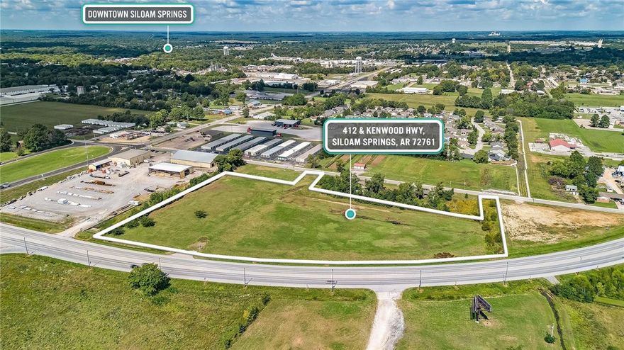 8+ acres m/l of open ready to develop land. Extreme high traffic area with over 800 feet of hwy 412 frontage also fronts kenwood street. Countless options. All utilities on or near site. Seller may consider divide.