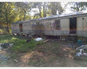 Looking for a couple of acres. Some clean up on this one, and it would be a great place to put your home. Trailer in poor condition. Taxes and acreage taken from county tax documents.