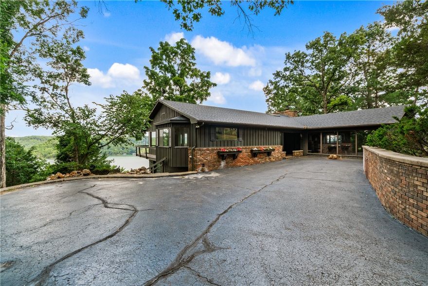 Breathtaking Views from Eagle Point on Beaver Lake!  Welcome to Eagle Point, one of the most coveted locations in the Sylvan Shores subdivision- named for the majestic eagles that often soar overhead.  Perched on 2.4 beautifully landscaped acres, this property offers sweeping panoramic views of stunning Beaver Lake in every direction.  Enjoy the peace of nature, surrounded by abundant wildlife, all while relaxing in a private and serene setting.  The modern, gently sloped driveway offers easy access down to the home, blending convenience with curb appeal.  Whether you're sipping your morning coffee or watching the sunset, the views from this property are simply unforgettable.  Don't miss your chance to own a piece of lakeview paradise at Eagle Point.