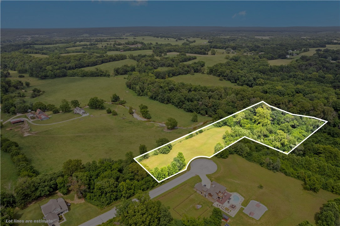 Beautiful +/- 5.29 acre tract just north of all schools in Pea Ridge! This property includes lots 9, 10, and
part of 11. A new study has been done showing the flood plain, with a little bit of dirt work the three top lots could be above the base flood elevation. Nestled within Creekside Estates, a small subdivision of just 17 estate homes, the property offers stunning views to the north and features Otter Creek running through its eastern portion. Situated approx. 2.3 miles from Pea Ridge High School, 3.1 miles from Walmart Neighborhood Market, and 20 minutes from Walmart's New World HQ Campus. On-site septic will be needed, water access is available on the other side of Bridgeford Dr. Enjoy the perfect blend of natural beauty and convenient location in this serene setting.