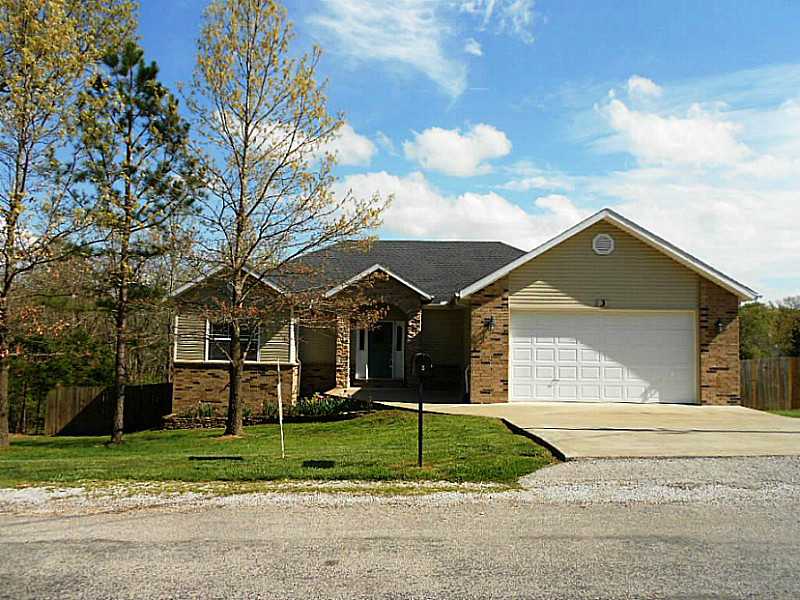 Large, privacy fenced backyard, surrounded by woods, New paint, new range & dishwasher, raised garden spot, landscaped, heavy duty stairway for attic access, wood floors, corian counters, pantry, freshly painted covered deck, close in with easy access to,Bentonville & Cooper Elementary. Level drive. Split bedroom plan. Very nice, well maintained home, concrete storage area/workshop with double door access from backyard. Move in ready!