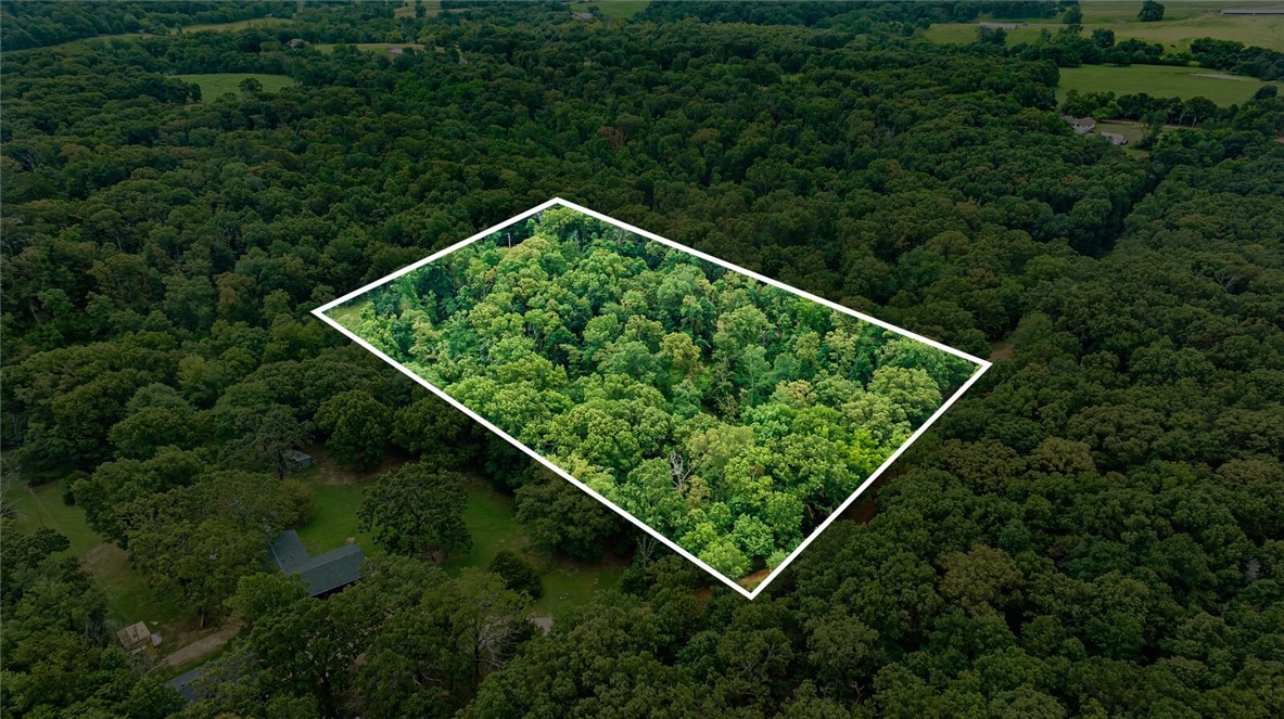 Build your dream home on this secluded 3.5-acre wooded lot. This property offers the ultimate privacy and tranquility. With flat spots ideal for construction, it's the perfect location for your custom home. Survey and Perc Test are available for a 4-bedroom home.