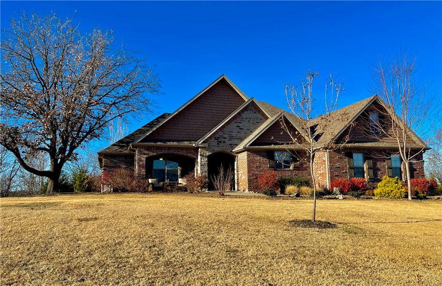 Talk about rare and gorgeous! Custom built 4BR/3 Full BA home on over 2.7 private, wooded acres in gated Estates of Lakeway. This lake home comes w/ it's very own boat slip with lift in neighborhood dock. It boasts of exclusive ownership, plus enormous swimming platform all located on a cove on Beaver Lake. Home has been immaculately kept w/ pride of ownership throughout. Expansive, open floor plan complete w/ chef's kitchen, large center island, GE appliances, granite countertops, and even a cabinet with stand mixer lift! Wood floors and a cozy wood burning fireplace highlight the huge living room which opens to a covered area with outdoor fireplace, rock patio, and private backyard with peach, cherry, apple, & pecan trees. Upstairs was built for ultimate flexibility. It easily serves as a second master with a full bath, but is also built as your family media, exercise, bonus or hobby room. The Master BR has private patio access, a massive master BA and closet that adjoins the utility room. So Smart!