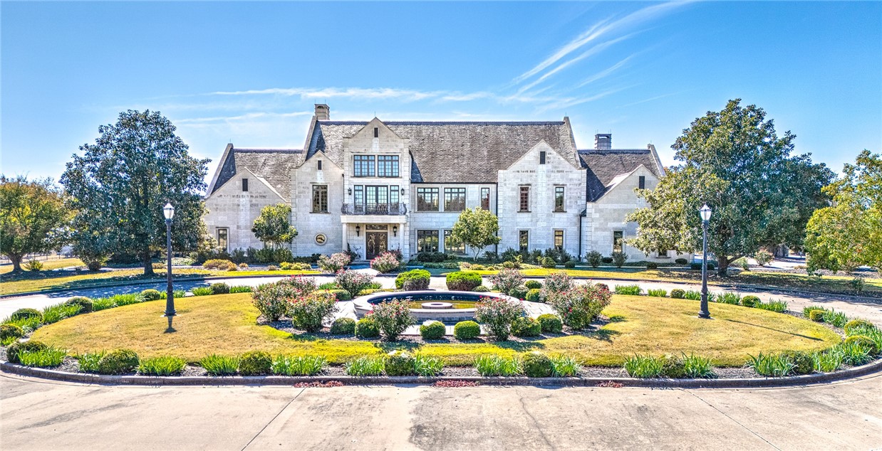 Situated on 250 acres just 20 minutes south of Harrison, Arkansas, this exquisite home features five bedrooms, six full bathrooms, and two half baths, with a French country kitchen and primary wing with separate bathrooms is just the beginning. The property boasts of a media room, a family room with a wet bar, in-law quarters with one-bedroom, full bathroom, living room & kitchen and a generator. Limestone exterior with a slate roof, an 8-foot inground pool, a two-bedroom one-bath caretaker's house, a riding arena with observation deck and apartment, a horse barn with four stables, ponds, a basketball court, a lake with fishing pier, and a lake house with a half bath and kitchenette and so much more! Additional buildings: Well House has pool equipment, Riding Arena 10,790 s.f. with indoor tack room & observation deck, apartment w/ kitchen, full bath & bedroom, Horse Barn 4,400 s.f. -8 stall with under ground waterers, 2 wash bays & 2 tack rooms, plus a workshop 3,456 s.f. & tractor storage building 5,400 s.f.