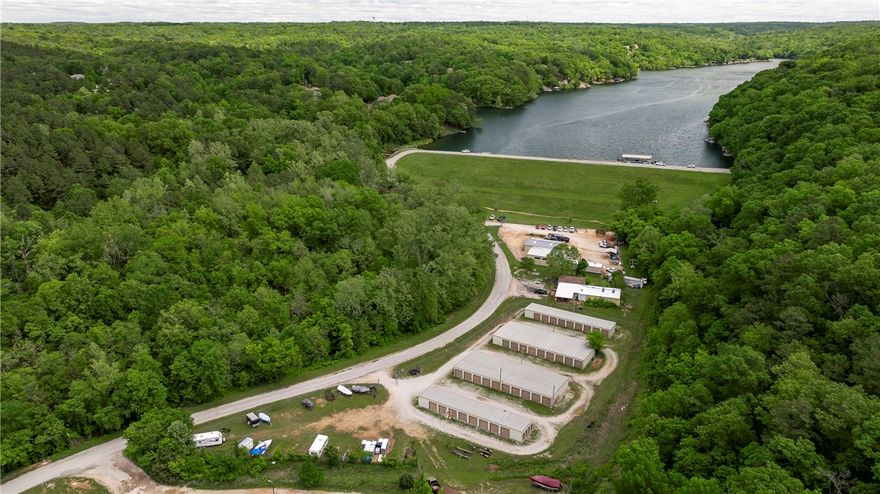 Check out this rare opportunity close to the middle of Bella Vista! This property has 87 storage units that are fenced in and 2 separate warehouses / workshops. This property also includes unimproved land that is used for RV and boat storage. This property is zoned as Light Industrial (I-1), allowing it to be used for many different uses. Across the road is Pinion Creek Falls which flows from Lake Ann which is right next to the property. Plus The Back 40 trail runs right by to the North, East, and South! Seller is willing to entertain seller financing.