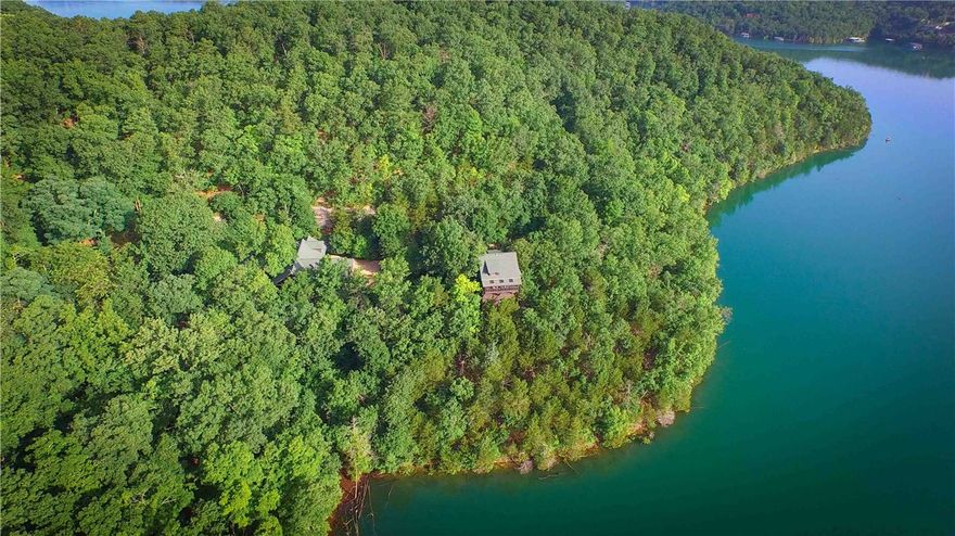 This estate includes over 35 acres of Ozark mountain woodlands and 3,700 feet of pristine Beaver Lake frontage. The property offers complete privacy with no drive by traffic. More than 4 years of design and construction went into earthwork, building and landscaping. Built with rustic luxury in mind. It is considered one of the most impressive estates in the area.  Winterwood is more than a home ...it is paradise.