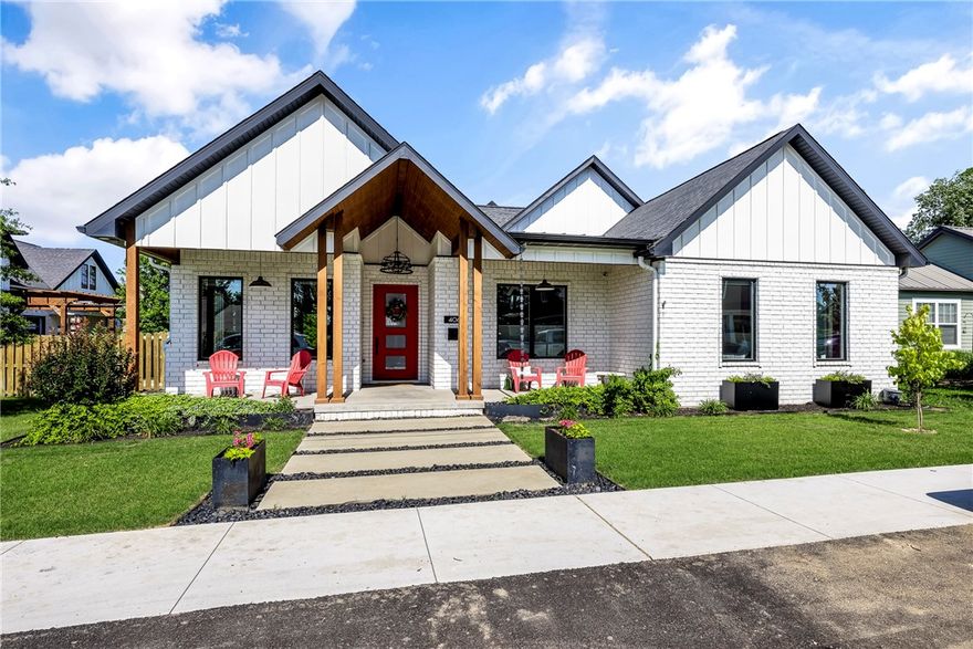 Luxury Meets Location in Downtown Bentonville. Showings begin Saturday. This custom-built masterpiece offers over 4,200 sqft of refined living just steps from the heart of downtown. Thoughtfully designed with soaring 20’ vaulted ceilings, handcrafted beams, and an open layout ideal for entertaining, the home features a chef’s kitchen with a 6-burner gas range, griddle, double ovens, paneled appliances, and built-in fridge. The main level hosts three bedrooms, including a luxurious primary suite with spa-like bath and oversized closet, plus a private office with French doors. Upstairs: a spacious bonus room, guest suite, and full bath. Outdoor living is elevated with a screened-in patio (back screen is electric), outdoor fireplace, built-in grill, and a generous backyard ready for a pool. All this plus a three car garage. Its rare to find this scale of home with elevated style in downtown—this home checks all the boxes.