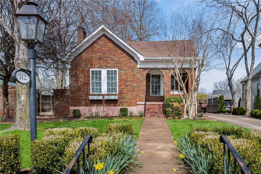 A charming light-filled home located in the Historic District. This 2314 sq.ft. home has many updates including a primary suite addition with large walk-in shower and walk-in closet. The home has three bedrooms, two full baths, and an updated kitchen with stainless steel appliances, an island with gas range top and Carrera marble countertops. The backyard is fenced and includes a covered porch and outdoor space for entertaining. This beautiful home is in walking distance to the Fayetteville Square and Entertainment District.