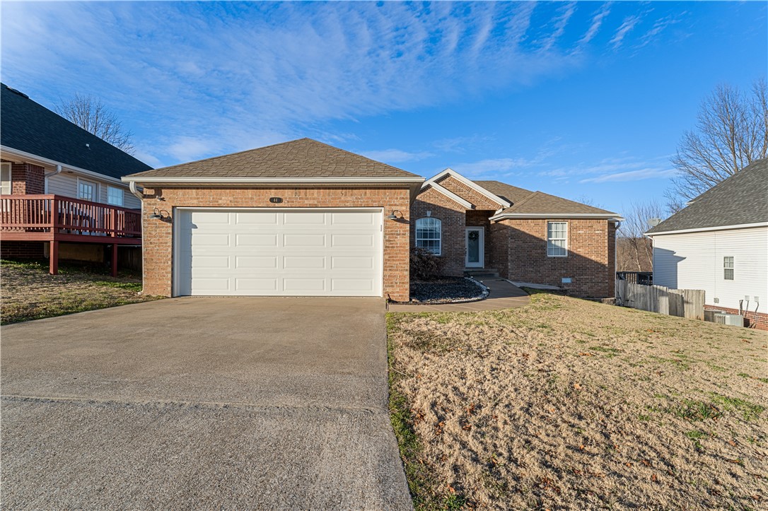Just a few blocks north of Tiger Boulevard in Bentonville, 44 Valley View sits in the quietly serene Northaven Hills subdivision. In the common area, it has a formal dining area, a corner gas fireplace in the living area, and crown molding throughout both. The kitchen has a bright breakfast nook framed by big windows overlooking the backyard, plus a pantry, island with sink and spare seating space, and stainless appliances. One of the coolest features is the triple-arch design on the wall separating the kitchen and living area, both a conversation piece for guests and a benefit for entertaining. In the primary bedroom ensuite, enjoy double vanity, soaking tub, walk-in shower, and a walk-in closet through French doors. All bedrooms feature ceiling fans. In the privacy-fenced backyard, there is an elevated deck leading down to a second entertaining area. This home is close to Bella Vistaās trails and scenery, Bentonvilleās downtown square, NWACC, and the Walmart home office.