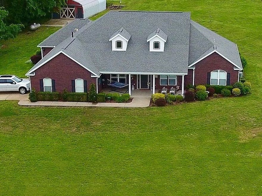 This executive estate style home sits on 10+ beautiful acres down a private drive that is fully paved. Beautiful 4 bedroom, 4 bathroom, 3 car garage home on 10.50 acre parcel in rural Siloam Springs. Bonus room could make a 5th bedroom.  Beautiful custom cabinets in study/office room.  Large, gourmet kitchen with beautiful custom cabinetry, center island, and granite counter tops. Formal and eat-in dining areas. Huge living area with fireplace and high ceiling. Luxurious master bath suite with whirlpool tub and tiled walk-in shower. Spacious laundry room has with counter space, utility sink, and built-in ironing board.