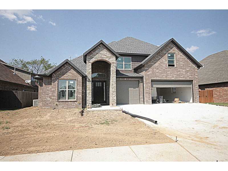 Unbelievable floor plan with two story living room. Exceptional built 3 car garage, brick & stone home w/hardwood floors, huge kitchen, central vac, home audio, security system, irrigation system, study & large bonus rm. Kitchen has large island w/veggi,e sink, walk in pantry, tons of cabinets and storage. Two story living room w/corner fireplace & windows open to covered deck. Large mud room w/cubbies and a spacious laundry room with sink and counter space. This is a must see floorplan!