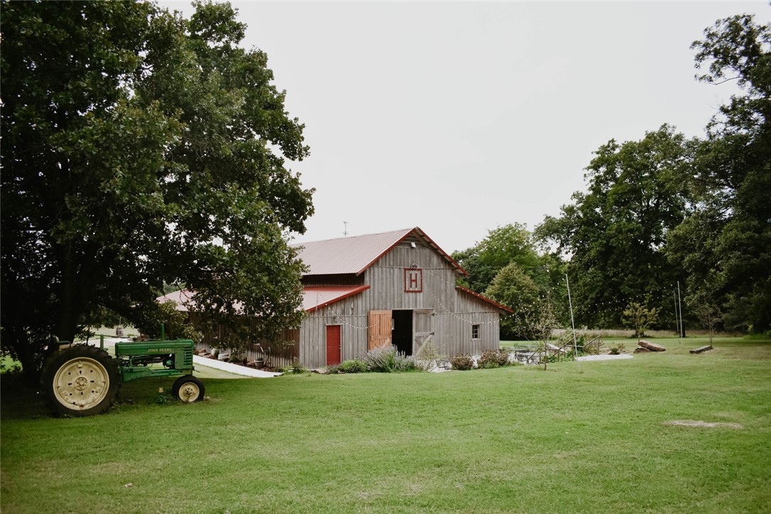 Amazing event venue space available for lease! 6.5 acres of land & multiple venue spaces including a 4,375 sq ft heated and cooled barn and a 1,775 sq ft non climate controlled chapel space for a total of 6,150 sq ft. Great potential for investment opportunity without the start-up costs, take over an already established event venue. Owner has over 40+ events per year without marketing. Potential for multiple event source revenue including, weddings, reunions, parties, craft fairs, car shows, and much more. A spacious pasture setting with surrounding woods offers a serene landscape that many clients will enjoy. The main barn has plenty of space for large gatherings with vaulted ceilings, wood beam details, concrete floors, and a beautiful white interior. Smaller chapel space is perfect for intimate gatherings and smaller events giving you the option of hosting a wide variety of sizes for events. Prime opportunity to start your event planning business!