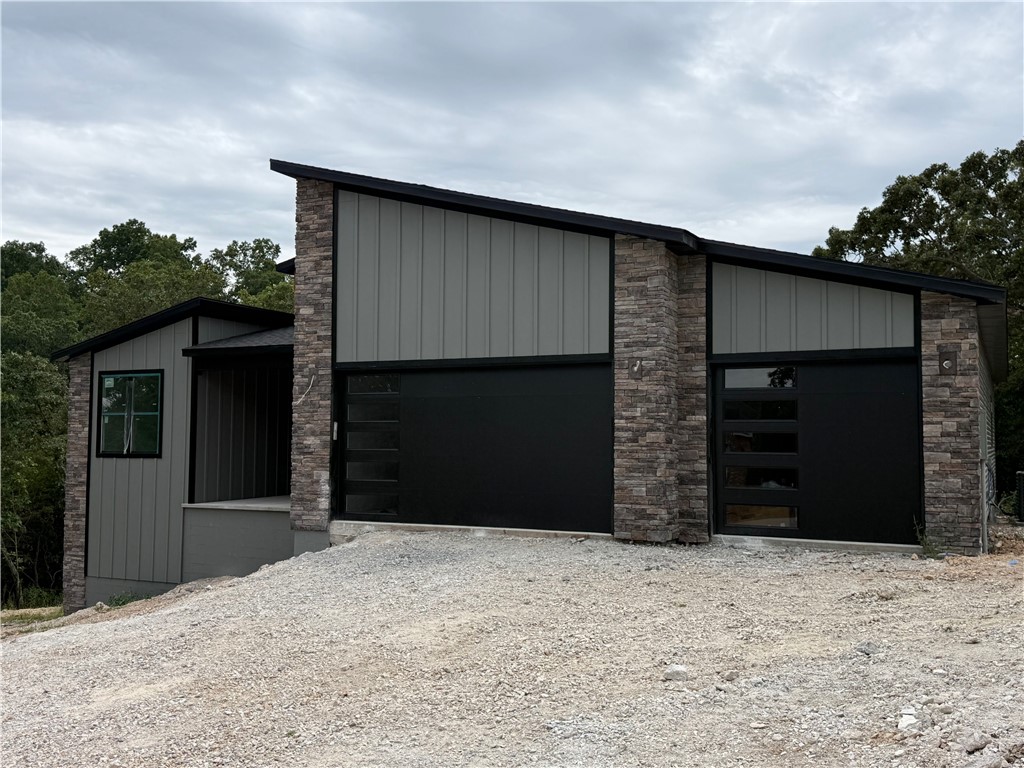 Beautiful contemporary new construction on two spacious lots! This 4-bed, 2.5-bath home features an eat-in kitchen with waterfall island, one-piece backsplash, gas range with blower vent, and a hidden walk-in pantry. No carpet—just tile and premium LVP throughout. Built with Zip System sheathing and Solar Board roofing to keep the home energy-efficient and the attic up to 40° cooler in Summer. Nearly complete, with options to personalize: choose your back porch handrail, perhaps add an accent wall, and select either a backfilled concrete sidewalk with a retaining wall or a high-end composite deck with metal railing for the front entry. Room available to add a detached garage on the upper side. Act fast and make it your own!