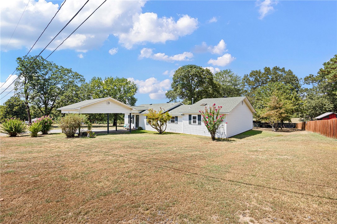 Beautifully updated 3-bedroom, 2.5-bath home in the heart of Morrilton! Featuring a remodeled kitchen with custom cabinets and countertops, a spacious den addition, and a custom deck, this home is designed for comfort and entertaining. Major upgrades include new windows, siding, insulation, and a 20x20 two-car carport (2014). Recent renovations bring modern style with granite bathroom countertops, vinyl flooring throughout, fresh trim and paint (2024), plus a brand-new gas water heater (2025). Features RV storage with a 30-amp plug and a shop with electricity. Move-in ready with timeless charm and thoughtful updates throughout!