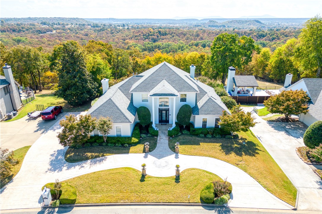 Luxurious custom-Built home with breathtaking views! Nestled on 1.76 acres of impeccably landscaped grounds.This fully renovated home exudes sophistication, combining modern luxury & timeless elegance.The main level greets you w/opulent granite floors & large windows that bathe the home in natural light, and stunning view. The expansive primary suite is a sanctuary of relaxation, featuring a spa-inspired bath w/premium finishes.The sweeping staircase leads to additional bedrooms with ample space. The gourmet kitchen boast top-of-the-line appliances, custom cabinetry, an open layout perfect for entertaining. Step outside to your own private oasis, an in-ground pool ideal for unwinding or hosting gatherings in unparalleled serenity. With automated toilets in every bathroom, no detail has been overlooked in ensuring your comfort and convenience. This home is truly a jewel offering a luxurious living experience like no other. Make your appointment today to discover all that this exceptional home has to offer!