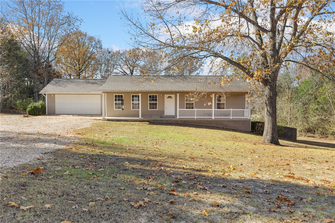 Perfect for the family that needs a lot of space and a large shop building!! This 4 bedroom home with 6-car garages is perfect for a large family in a quiet setting with a pasture as the back yard. The open concept living room, kitchen and dining area with a cathedral ceiling makes it feel very spacious and great for entertaining. The master bedroom has two closets and a master bath. In the finished basement there are two bedrooms, two separate den/family rooms with numerous possibilities and a large bathroom. A third garage/workshop is in the basement also. There is a large deck leading to the 1212 sq ft garage with two garage doors to fit three cars, heated and cooled, and partial plumbing with septic capabilities.