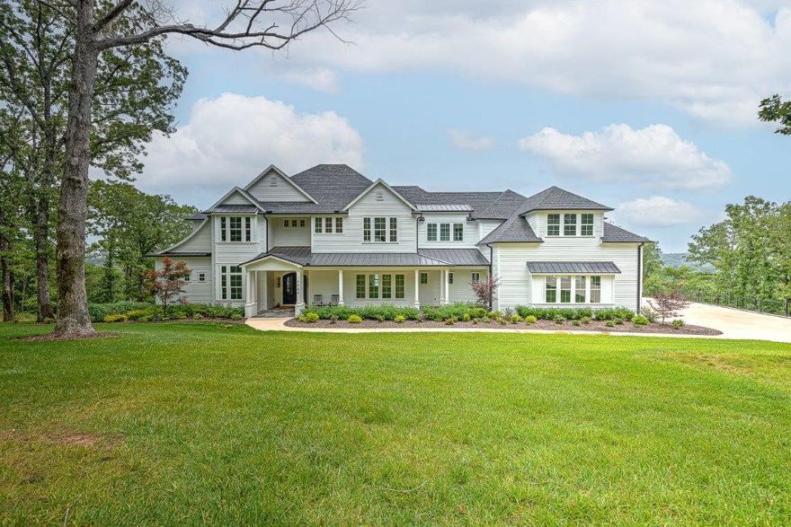 AWARD WINNING CUSTOM-BUILT LAKEFRONT MASTERPIECE nestled on a 4.08 acre dream-like setting with STUNNING year-round panoramic views of Beaver Lake!  Located on a quiet street atop a hill, this timeless estate enjoys 100 ft of lake frontage w/ two 30 x 10 boat slips in a private 4 slip dock!  Enjoy 3,500 sq ft of outdoor living space on multiple levels!  Meticulously designed w/ exceptional craftsmanship throughout, the 3 level interior boasts an open & flowing floorplan with large picture windows draping the home in natural light and highlighting the breathtaking lake views!  Stunning gourmet kitchen offers Thermador appliances w/ large island & incredible butler’s pantry, main level master suite w/ fireplace, formal dining, game/media room w/ wet bar, guest suite w/ private balcony, above garage bunk room/playroom, home gym, 2 offices, 2 laundry rooms, dog bath and walk-out basement w/ in-law suite featuring full kitchen, living, bedroom & full bath.  Just 10 min from Downtown Rogers and 15 min to Pinnacle Hills!