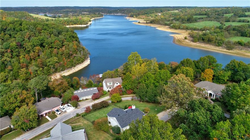 Just in time for the holidays!  Experience the best of Beaver Lake living in this fully furnished, move-in-ready retreat offering breathtaking year-round views! Thoughtfully designed for relaxation and entertainment, the home includes two large living spaces, a wood-burning fireplace, and an upgraded bar area with a custom wood countertop. Step outside to enjoy quiet mornings overlooking the water or head down for direct lake access. A new roof provides added confidence, while the extended driveway and refreshed landscaping enhance everyday convenience. Proven as a VRBO income producer, this property delivers flexibility—use it as a primary residence, weekend escape, or revenue-generating investment. Ideally located with quick access to Bentonville, Fayetteville, and I-49, you’ll enjoy the perfect balance of lakeside serenity and Northwest Arkansas convenience. Rare opportunity at $689,000—schedule your showing today!