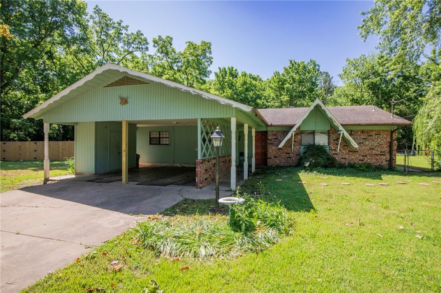 Cute Fixer-Upper in a Great East Fayetteville Location! If you’ve been looking for a home with good vibes and even better potential, this one’s for you. This cute starter home sits on a big 0.40-acre lot just a short walk to Gulley Park and with easy access to the Razorback Greenway—perfect for morning jogs, bike rides, or evening strolls. There’s a huge Magnolia tree out front that adds tons of charm, and the spacious yard offers plenty of room to play, garden, or just hang out. The house itself could use some TLC, but with the right updates, it could really shine. Whether you're a first-time buyer ready to make something your own or looking for a great project in a prime location, this home has all the right ingredients. Come see the potential! Sold AS-IS