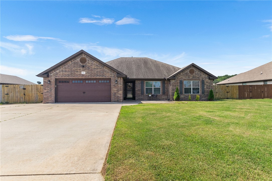 Welcome to 955 Red Oak St. in the charming Oakleaf Manor subdivision. Find everything you need in this spacious 1992 sq. ft. home with 5 bedrooms and 2 baths. This home comes with custom woodwork, fresh paint, and plenty of room in the backyard for a large garden or even a pool! You can store your lawn equipment in the 160 square foot storage building and sit and watch the rain under your covered back patio. Let's not forget the oversized drive way that can host your kids dunk contest or a great pad for shooting fireworks. This home is located close to everything Fayetteville has to offer or head east and drive through what some people call the best part of the Ozarks. This house is sure to please...come see for yourself!