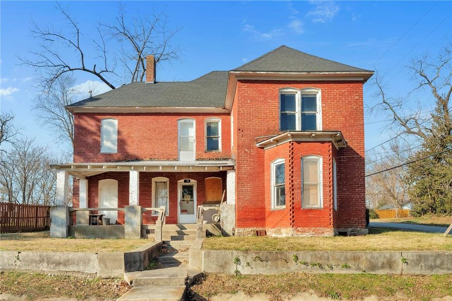 Built in 1905, this gem of a historic home offers a rare opportunity for those with a passion for preservation to restore a piece of Centerton’s past. This property is listed on the Arkansas Historical Homes Registry and is a cornerstone of old Centerton, where neighbors would walk by to share the news of the day. Located in the heart of Old Town Downtown Centerton, the property sits within a designated zoning area poised for revitalization in the coming years, making it an exceptional investment. The property has been unoccupied for several years and will require extensive repairs, ideal for a skilled renovator or investor to reimagine its original charm. Within one block you will discover the historic McKissick Springs, Marrs Mercantile, The Ravington, and City Park, making this property perfectly positioned in one of Centerton’s most evolving areas. Additionally, an incoming Walmart Supercenter will be minutes away. A rare chance to restore, reimagine, and contribute to the next chapter of Old Town Centerton.