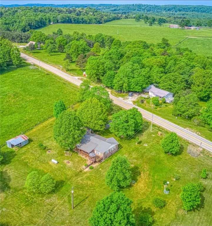 Enjoy comfort and adventure at the Bluebird House! This 2,725 sq ft, 3-bed, 2-bath all-brick home on 2.07 serene acres is perfectly located off HWY-74 W in Newton Countyājust minutes from the Buffalo National River, waterfalls, biking trails, and climbing spots. Close to Steele Creek, Kyleās Landing, Horseshoe Canyon, and Jasper. The main level features a spacious kitchen, dining area, two bedrooms, full bath, and two cozy living rooms. Downstairs offers a private retreat with a large bedroom, bath, laundry, and extra storageāideal for guests or in-laws. Recently updated windows and flooring. Outside youāll find a two-car garage, 17x20 barn, horseshoe pit, firepit, covered porch, and gazebo with stunning views. Located in a Dark Sky Park, enjoy stargazing and clear views of the Milky Way. The Bluebird House is an established nightly rental with a solid historyāperfect as a turn-key investment or peaceful permanent home.