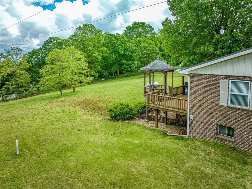 Enjoy comfort and adventure at the Bluebird House! This 2,725 sq ft, 3-bed, 2-bath all-brick home on 2.07 serene acres is perfectly located off HWY-74 W in Newton County—just minutes from the Buffalo National River, waterfalls, biking trails, and climbing spots. Close to Steele Creek, Kyle’s Landing, Horseshoe Canyon, and Jasper. The main level features a spacious kitchen, dining area, two bedrooms, full bath, and two cozy living rooms. Downstairs offers a private retreat with a large bedroom, bath, laundry, and extra storage—ideal for guests or in-laws. Recently updated windows and flooring. Outside you’ll find a two-car garage, 17x20 barn, horseshoe pit, firepit, covered porch, and gazebo with stunning views. Located in a Dark Sky Park, enjoy stargazing and clear views of the Milky Way. The Bluebird House is an established nightly rental with a solid history—perfect as a turn-key investment or peaceful permanent home.
