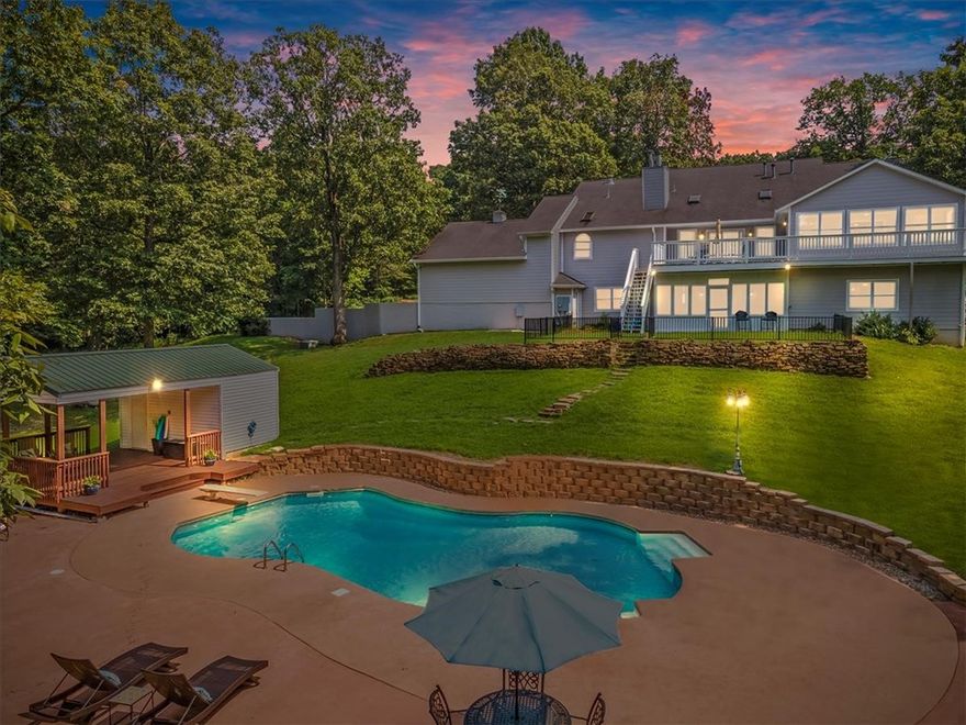 Amazing Beaver Lake Estate! Own your own private peninsula on 26.7 lakefront acres. This amazing property features a 5,494 SF estate home, private in-ground pool, covered pool house deck, horse stables w/ tack room, 65'x24' workshop, gated asphalt drive, & a hard to find private boat dock that's solar powered w/ 2 slips & lifts & lockers. This is lakefront living at it's best! Main home features all wood flooring & tile in bathrooms (no carpet) throughout entire home. Main level includes master bedroom w/ additional sitting area facing the lake plus office, formal dining, & 2 more spare bedrooms. Finished walk-out basement w/ media room, huge sunroom, large storage, & 4 more bedrooms. Chef's kitchen w/ center island, stainless apps, 2 ovens, gas range, trash compactor, ice maker, & more. Don't miss the mixer lift in center island cabinet (perfect for your heavy KitchenAid mixer). Geothermal duel fuel heating & cooling system (very low utilities). Huge 105 Gal Marathon water heater. Private salt pool & so much more!