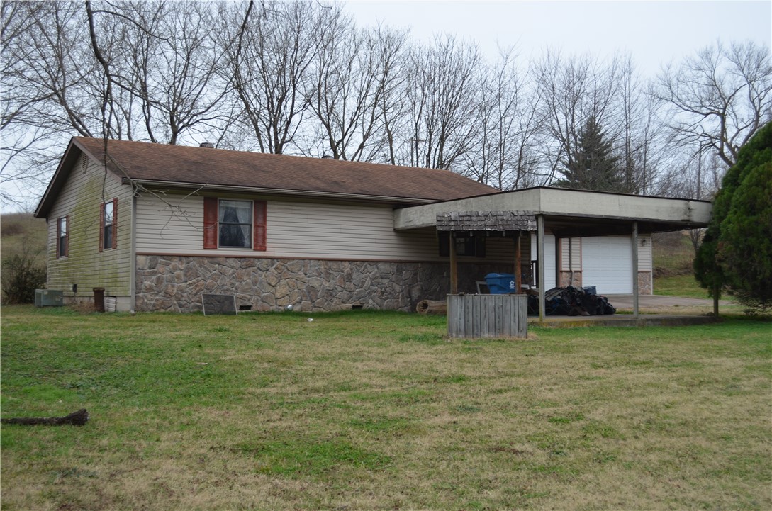 Start the New year off right with this nice fixer upper, 2 bed 1 bath home on Hwy 72 east of downtown, also has 3/4 bath in the attached 2 car garage all sitting on 2 lots. This home will NOT go FHA,RD OR VA.Estate owned Sold AS IS,Seller will not make any repairs.
Cash or Conventional in house financing only. Close to Schools, 20 min to Bentonville with new By pass.